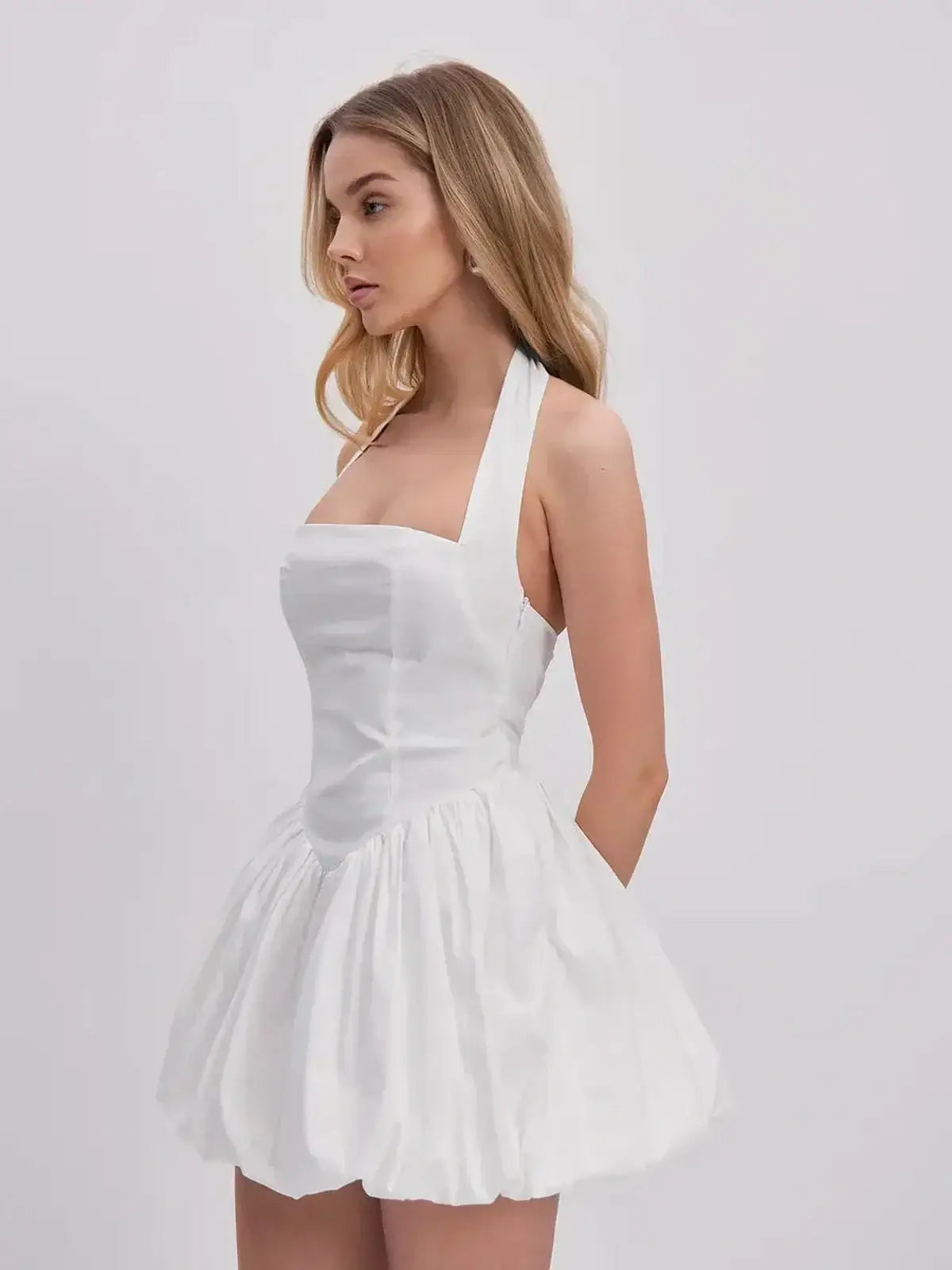 Cloud Belle white mini dress with halter neckline and bubble hem, perfect for summer parties and wedding guest outfits.