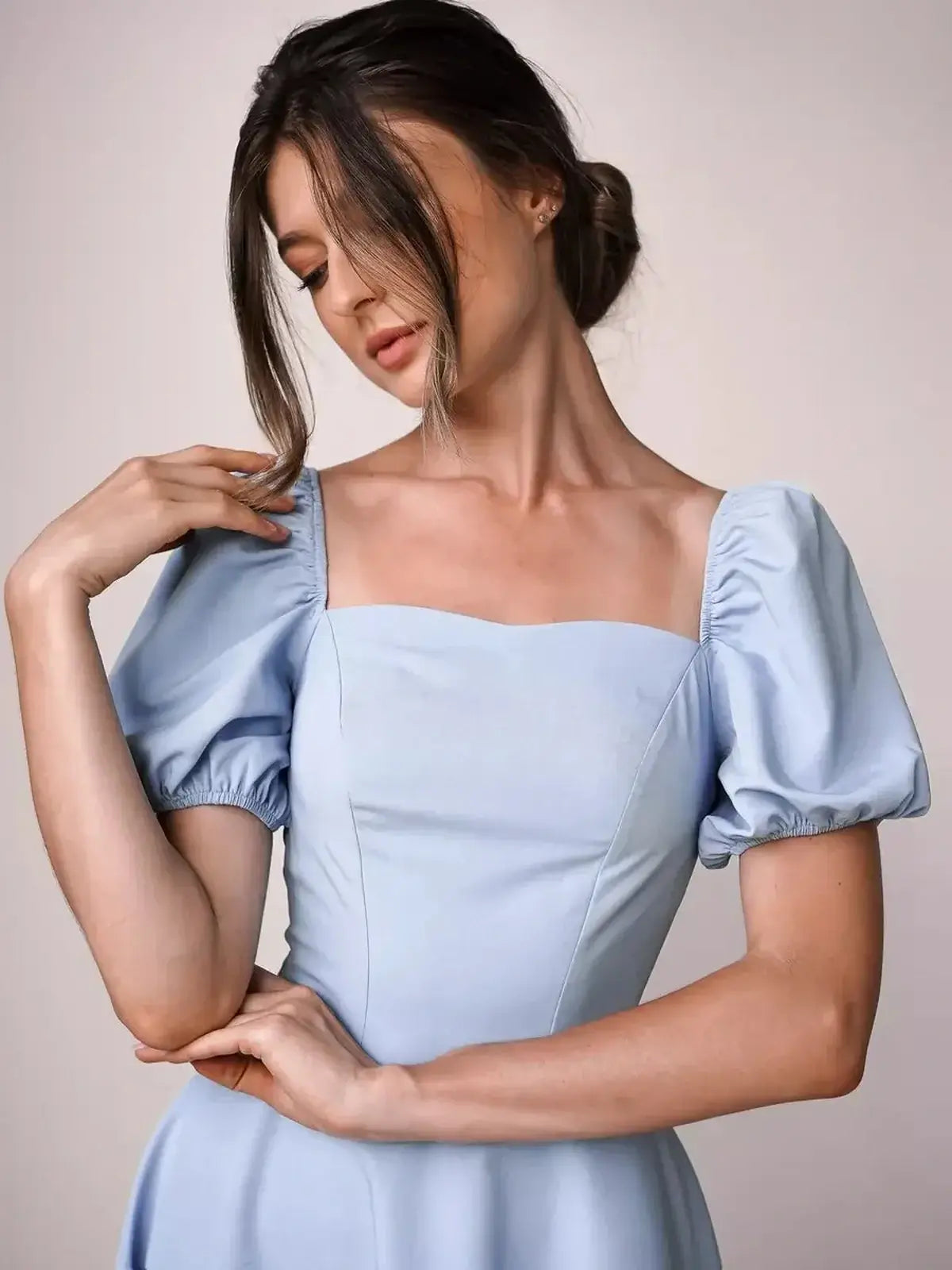 Elegant blue mini dress with puff sleeves and a square neckline, perfect for summer weddings and special occasions.