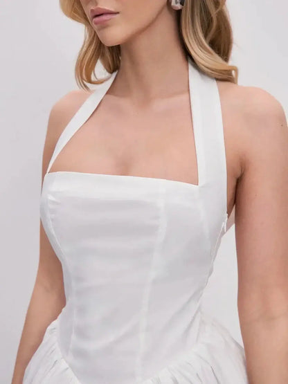Close-up of the Cloud Belle white dress featuring a halter neckline and structured corset bodice.