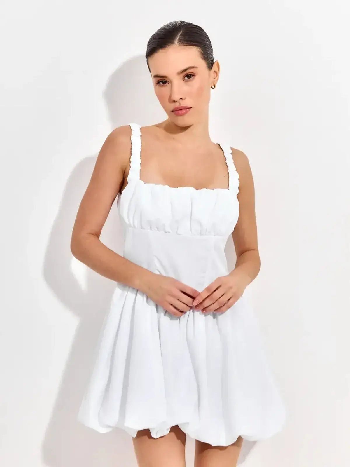 White mini dress with ruffled straps, perfect for summer parties, weddings, or special occasions.