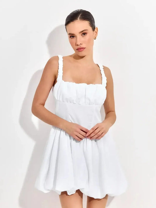 White mini dress with ruffled straps, perfect for summer parties, weddings, or special occasions.