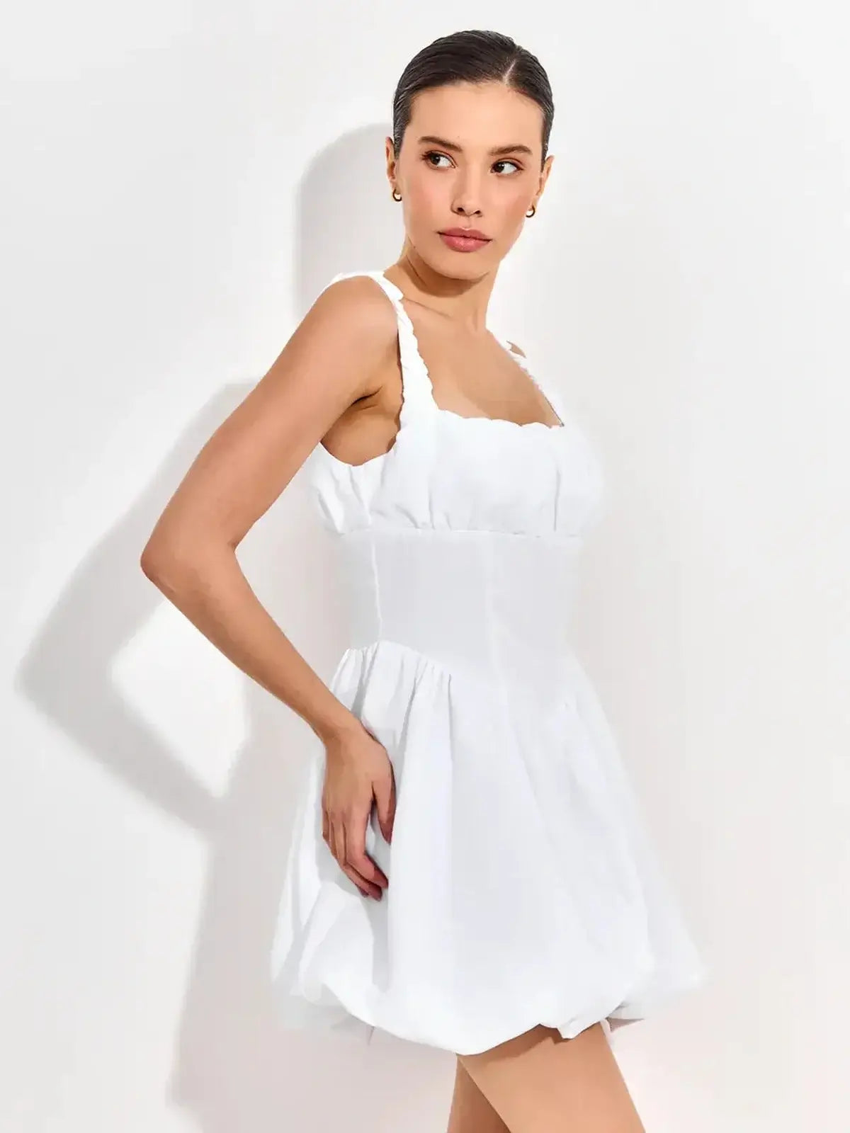 Whimsical Cloud Belle white mini dress with ruffled straps and sculpted bodice, perfect for summer celebrations.