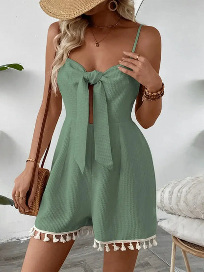 Coastal Bloom Mini Dress in green with bow tie and tassel hem, perfect for summer and wedding guest outfits.