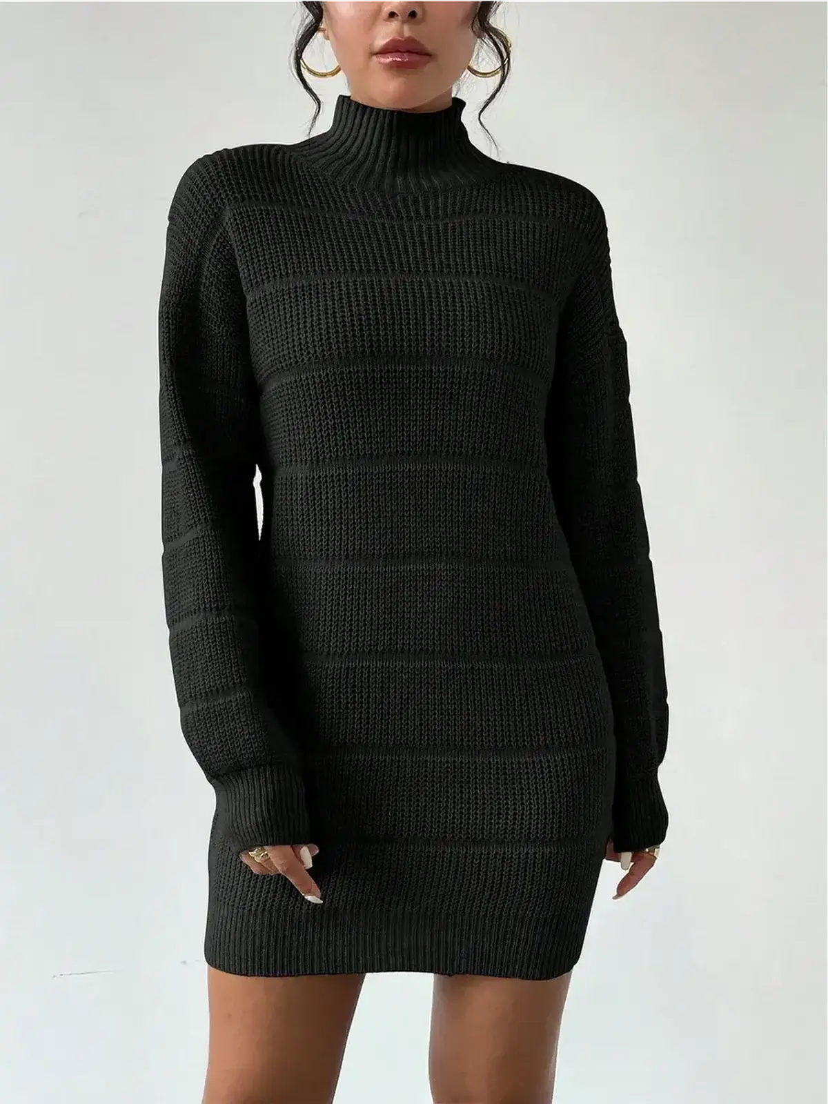 Cozy black mini dress with turtleneck and long sleeves, perfect for cocktail events and winter outings.