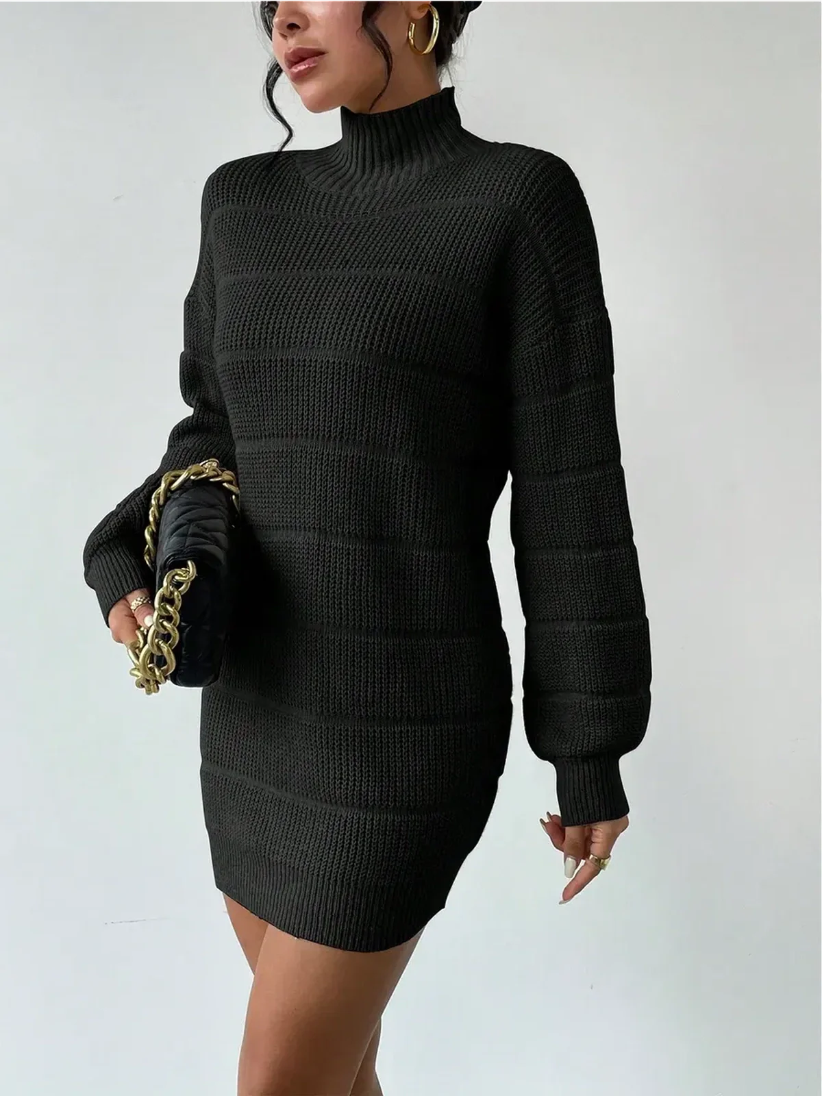 Cozy black mini dress with a high turtleneck and long sleeves, perfect for casual or formal occasions.
