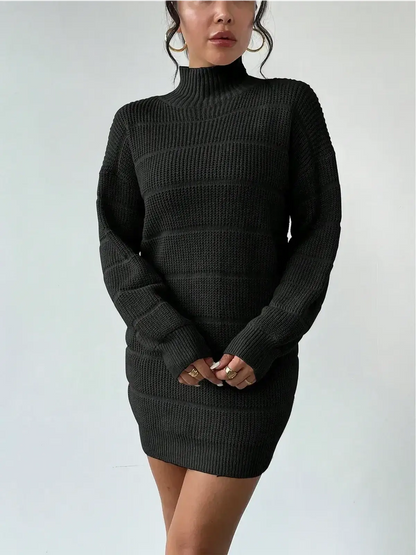 Cozy hourglass ribbed knit mini dress in black with long sleeves and high turtleneck for stylish warmth.
