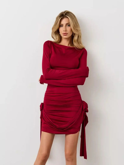 Crimson Bloom red mini dress with long sleeves and draped ruching, perfect for summer and cocktail occasions.