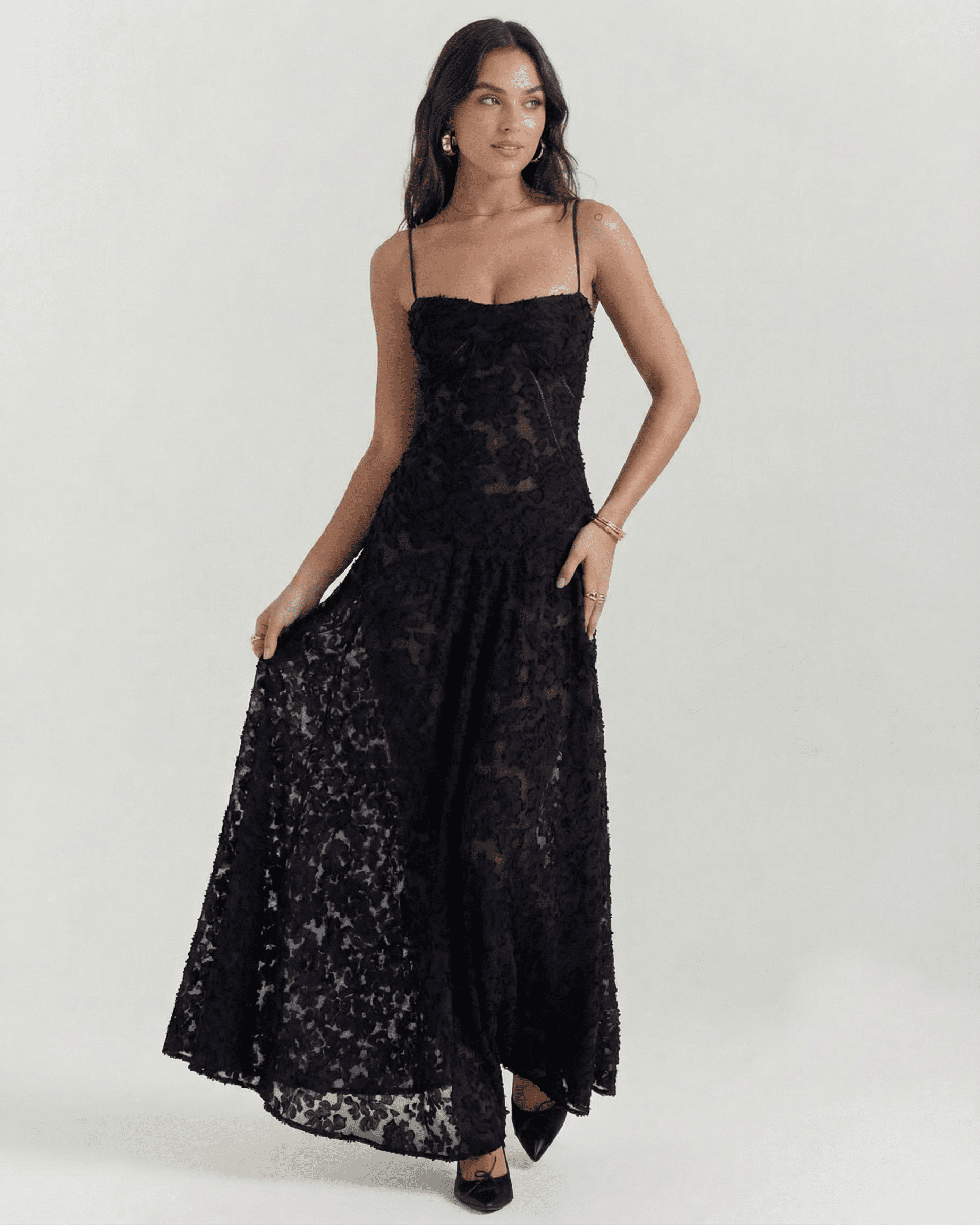 Nerina Maxi Dress by Slimona in black floral lace featuring a sheer back panel and adjustable straps.
