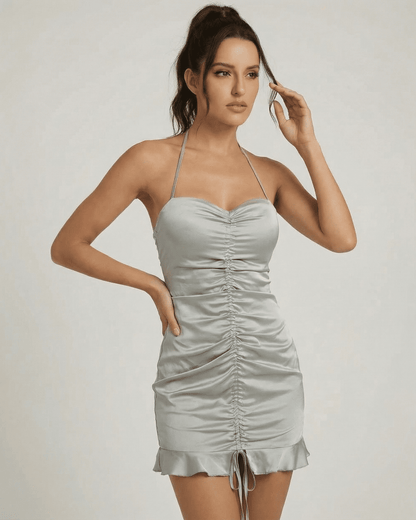 Celeste Mini Dress by Slimona in satin-effect with elegant ruching and open back, perfect for a polished look.
