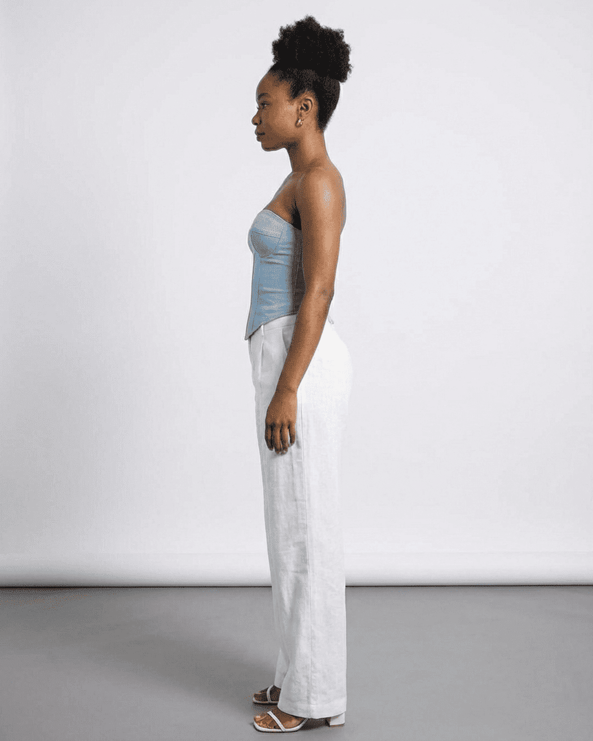 Denali Corset Top by Slimona, showcasing a blue faux denim cup bustier in a side profile view.