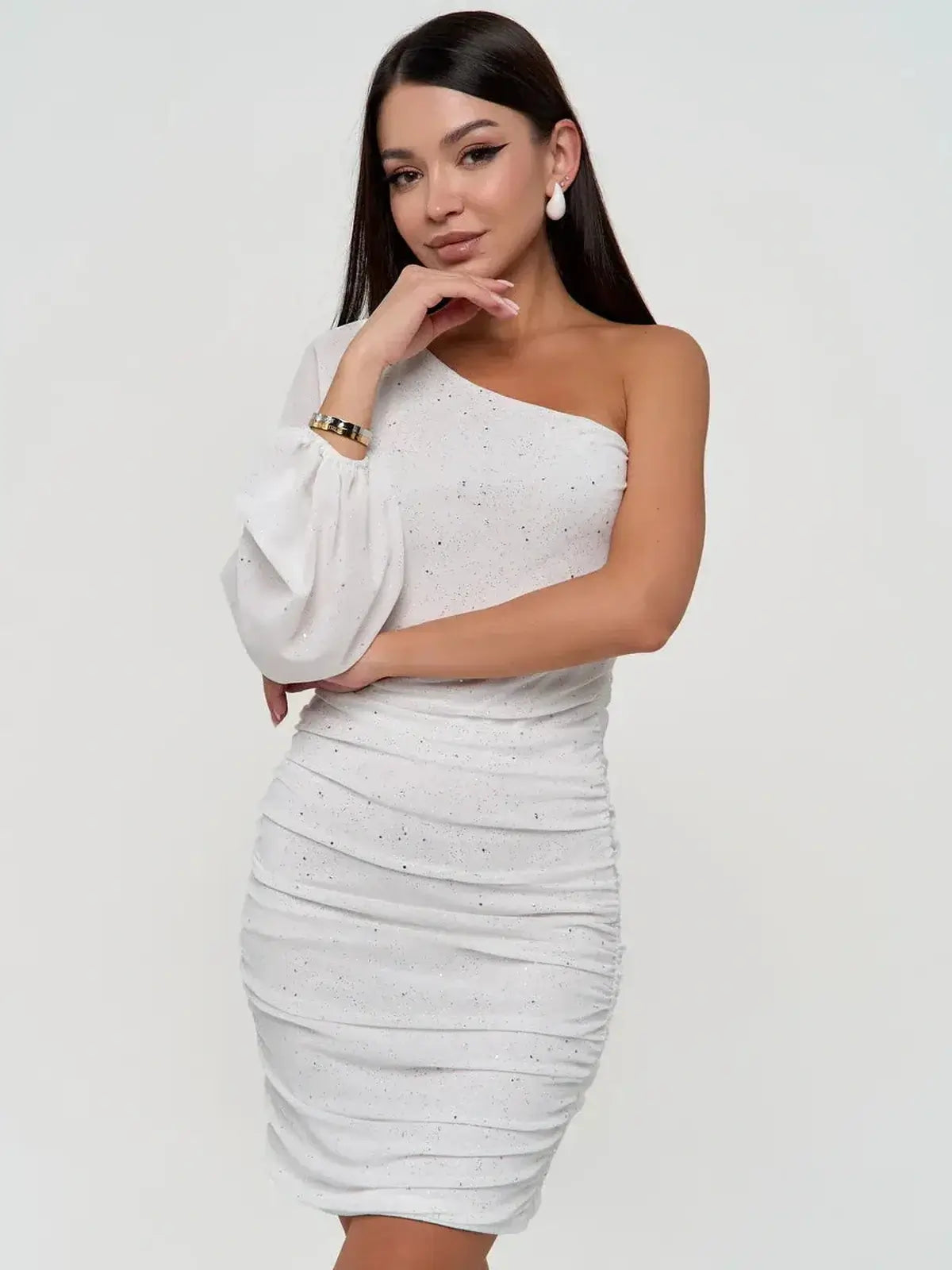 White mini dress featuring one-shoulder design and sheer puff sleeve, perfect for wedding guest dresses and evening events.