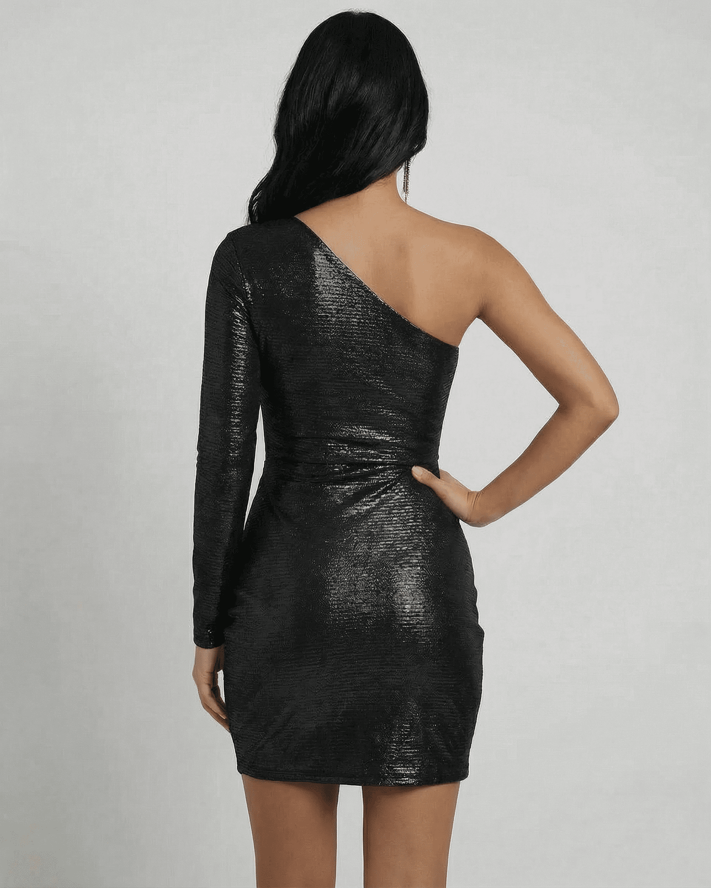 Back view of the Slimona Eclipse Mini Dress showcasing the asymmetrical one-shoulder design and metallic finish.