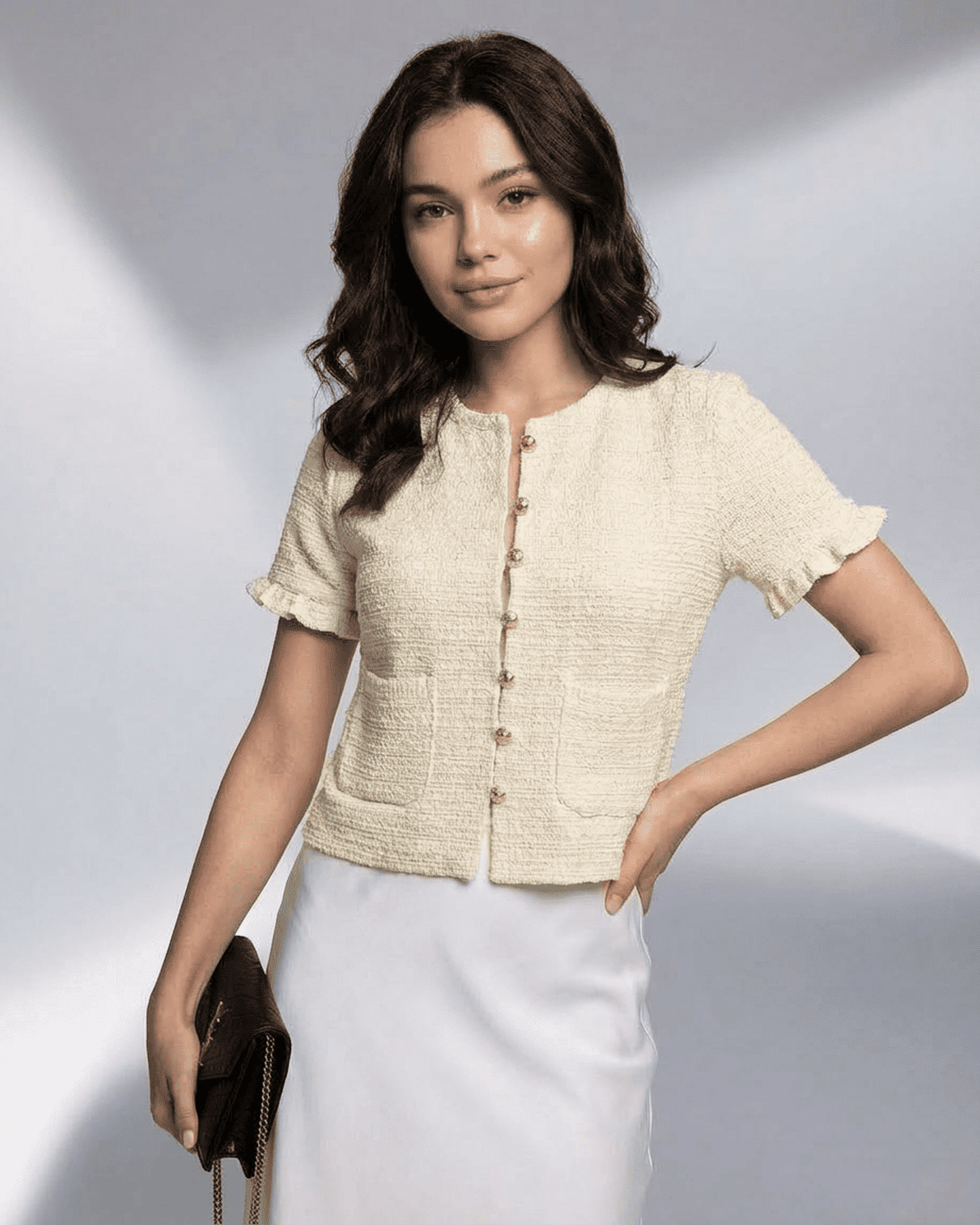 Elara Cardigan by Slimona showcasing a model wearing a short sleeve button knitwear in cream color.
