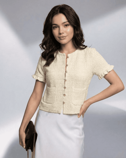 Elara Cardigan by Slimona showcasing a model wearing a short sleeve button knitwear in cream color.