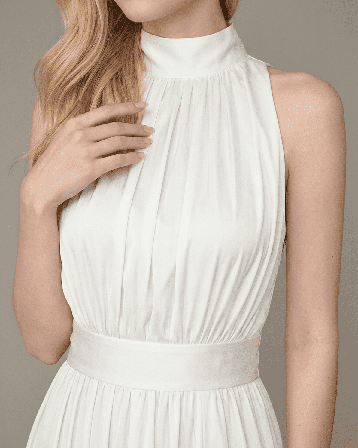 Elara Maxi Dress by Slimona showcasing the elegant sleeveless turtleneck and pleated design in a smooth white finish.