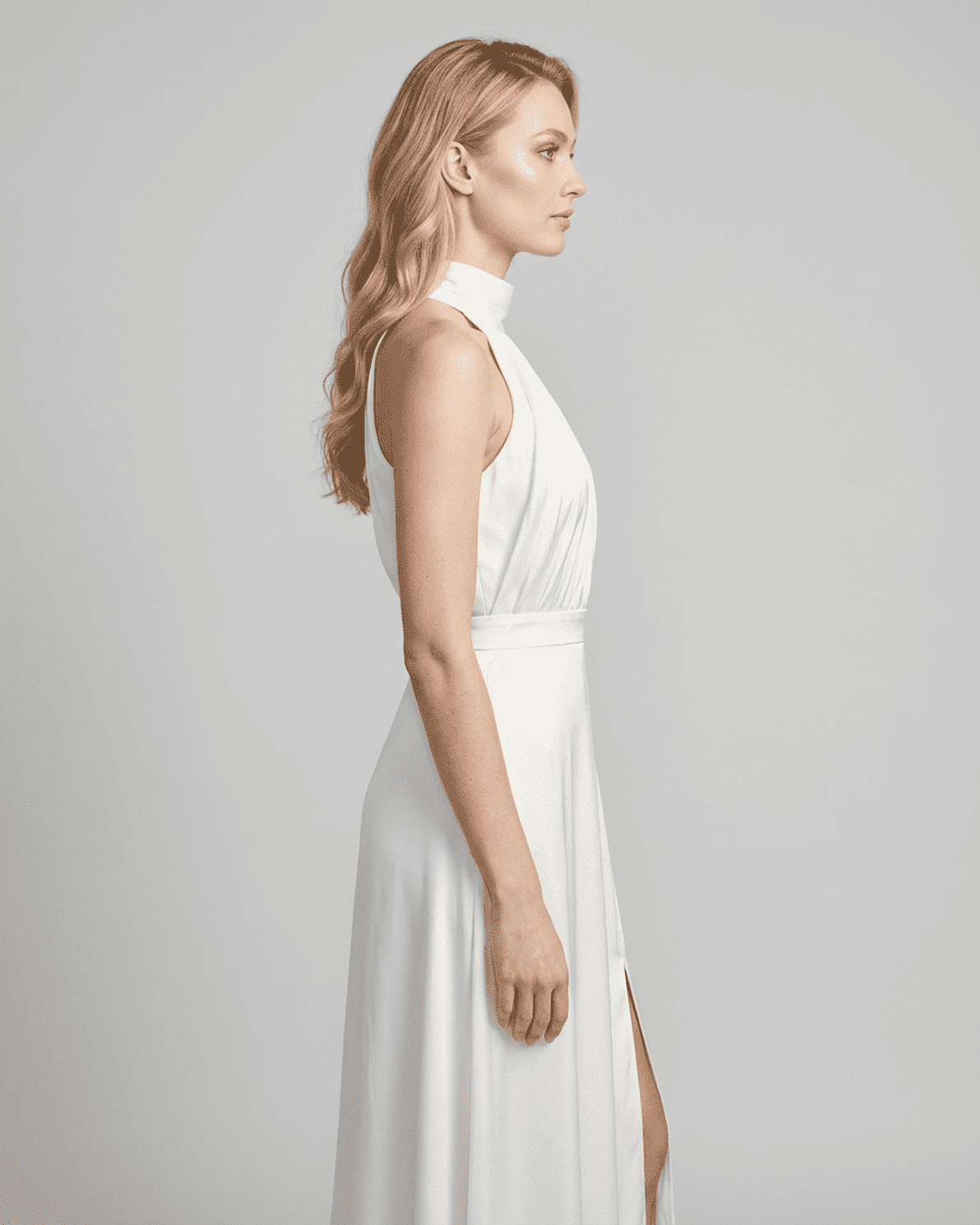 Elara Maxi Dress by Slimona in white, showcasing a sleeveless turtleneck design and elegant high waist.