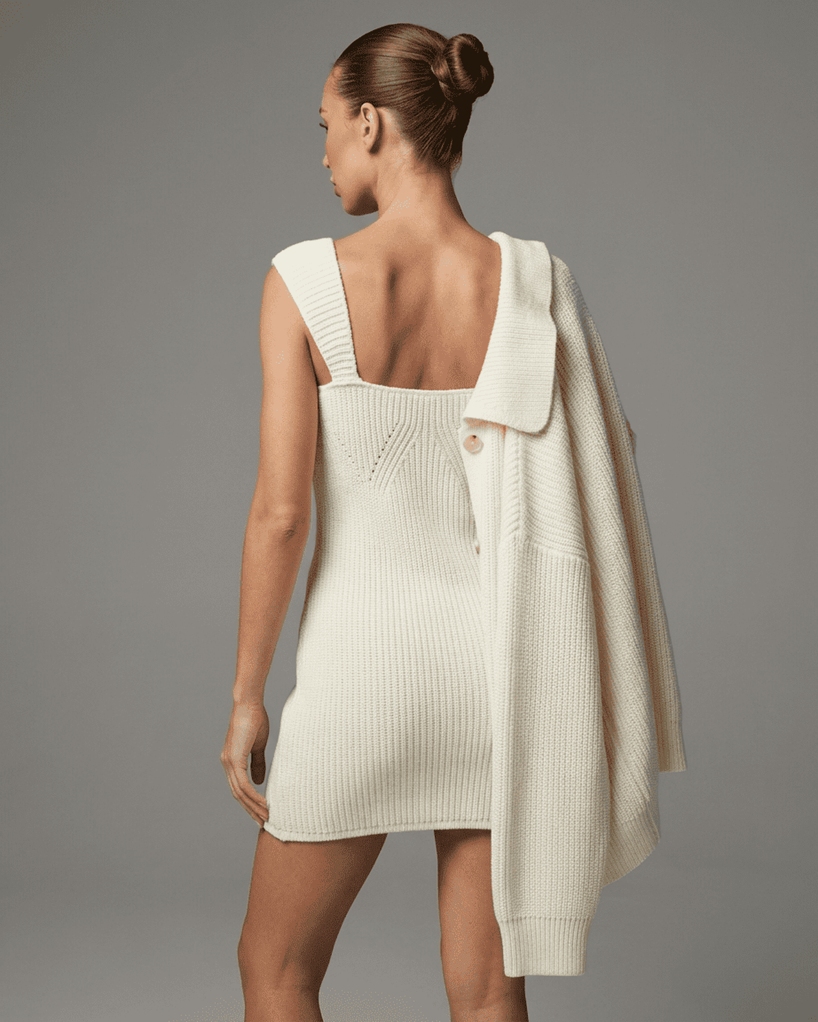 Elysia Mini Dress by Slimona, showcasing a chic fitted knit design with a modern high-waist profile.
