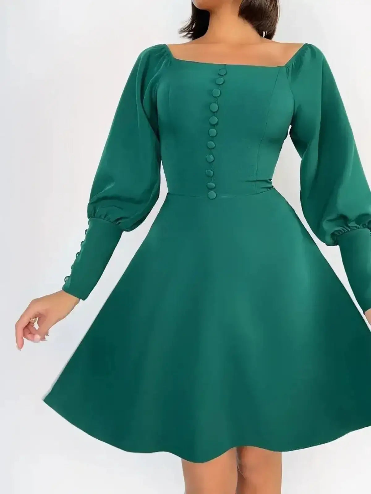 Emerald Era Mini Dress featuring a square neckline, structured long sleeves, and tonal front buttons in opulent green.
