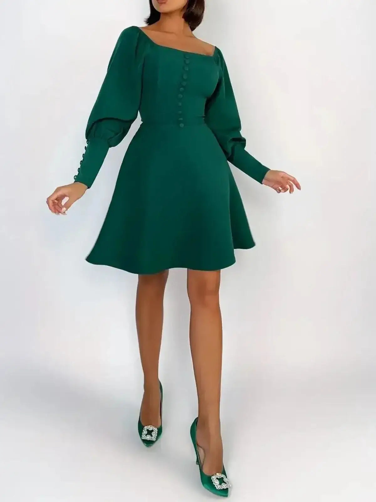 Emerald Era Mini Dress featuring a square neckline, long puff sleeves, and a flared skirt in vibrant green.