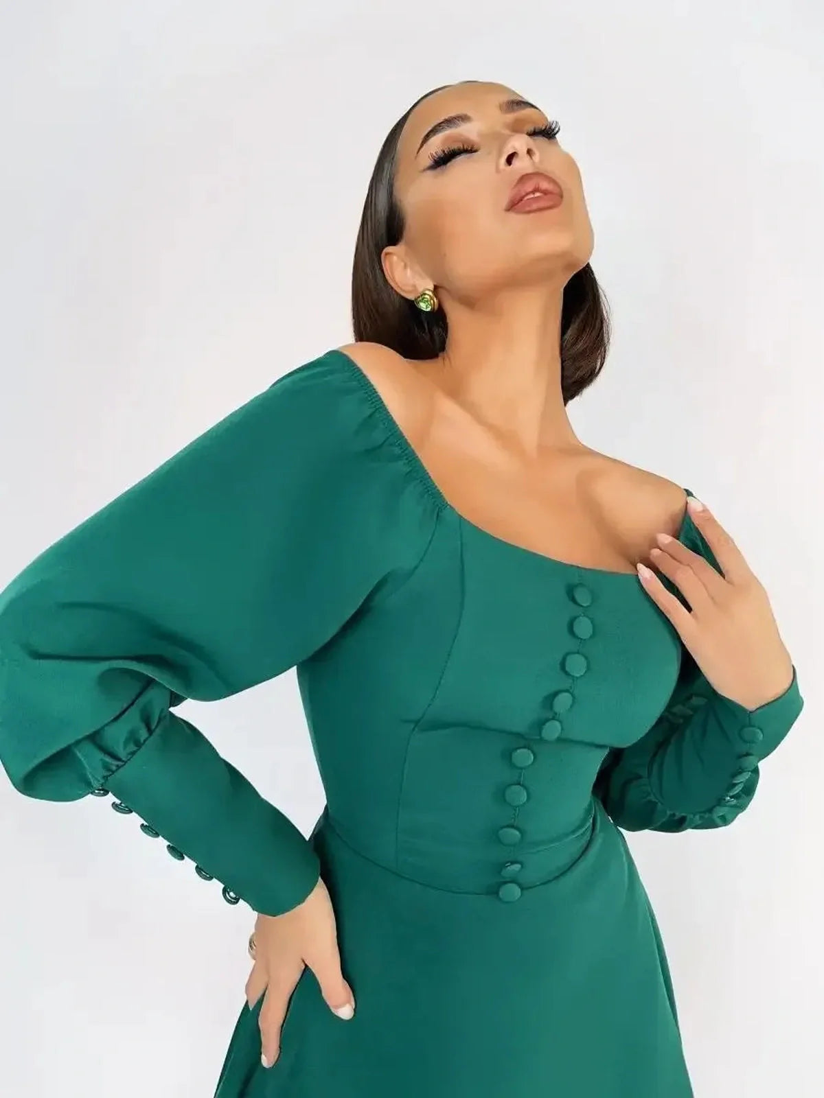 Emerald Era Mini Dress featuring a square neckline, structured long sleeves, and vintage-inspired buttons.