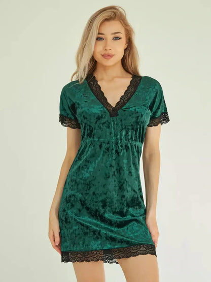 Emerald green velvet mini dress with lace trim, featuring a V-neckline and semi-fitted silhouette for women.