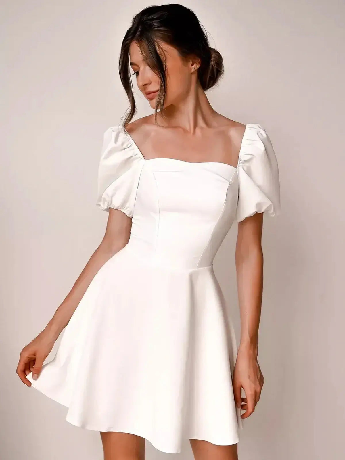 Ethereal Belle white mini dress with puff sleeves, perfect for summer weddings, parties, and special occasions.