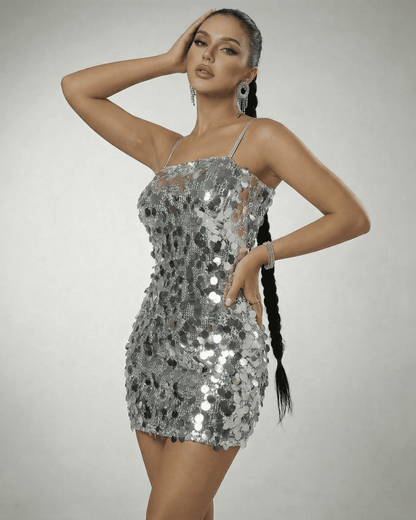 Stella Mini Dress by Slimona - Silver sequin off-the-shoulder mini dress showcasing high waist and sleeveless design.
