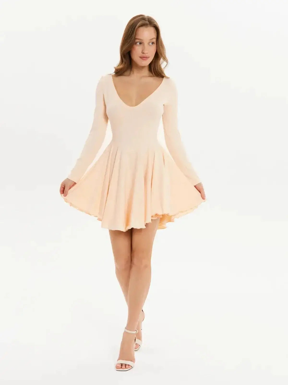 Flare Fit Mini dress in soft peach with long sleeves and a flared skirt, perfect for weddings or summer parties.