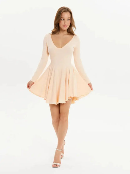 Flare Fit Mini dress in soft peach with long sleeves and a flared skirt, perfect for weddings or summer parties.
