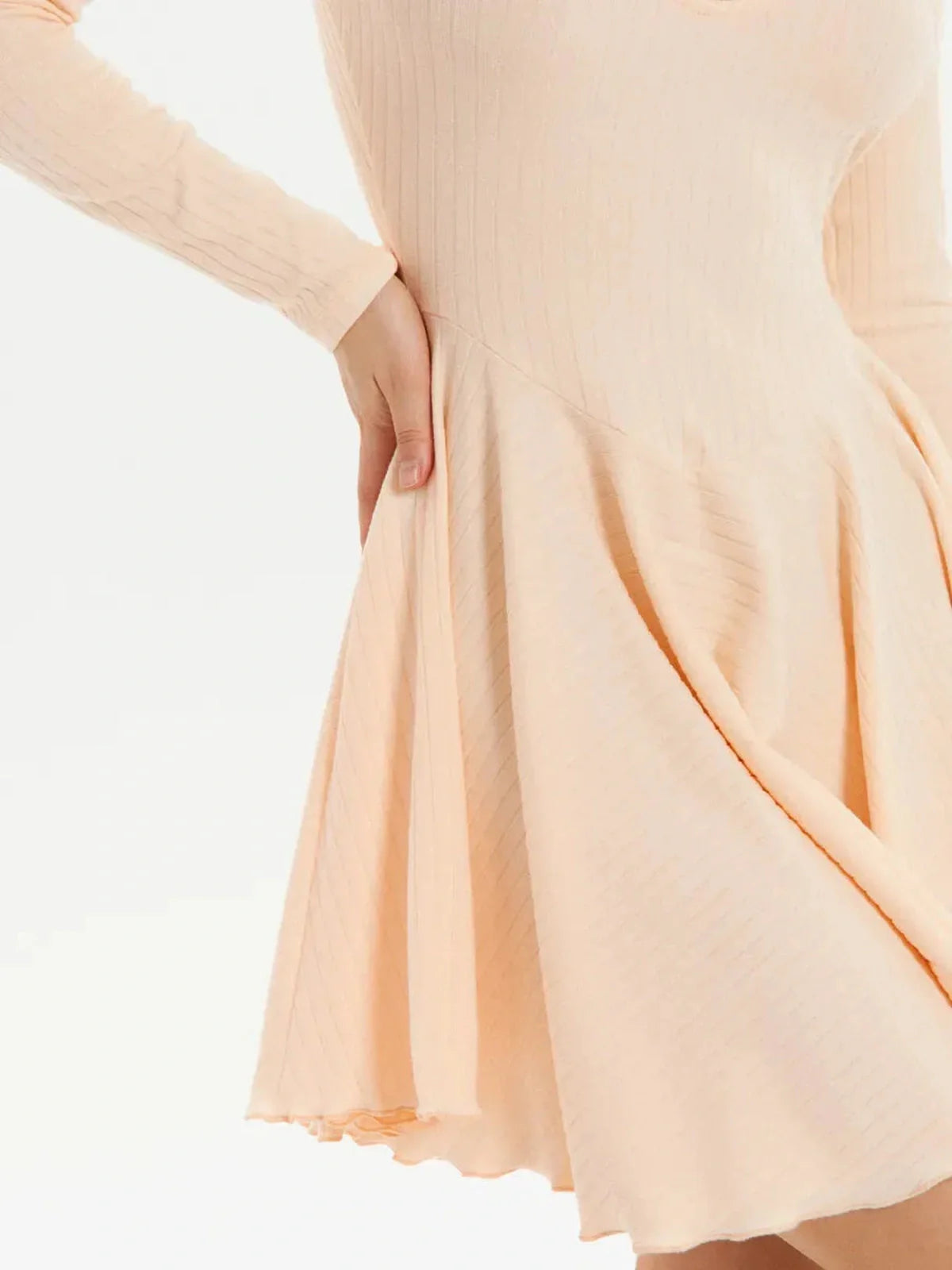 Flare Fit Mini, a light peach flared long sleeve mini dress perfect for wedding guests and summer parties.