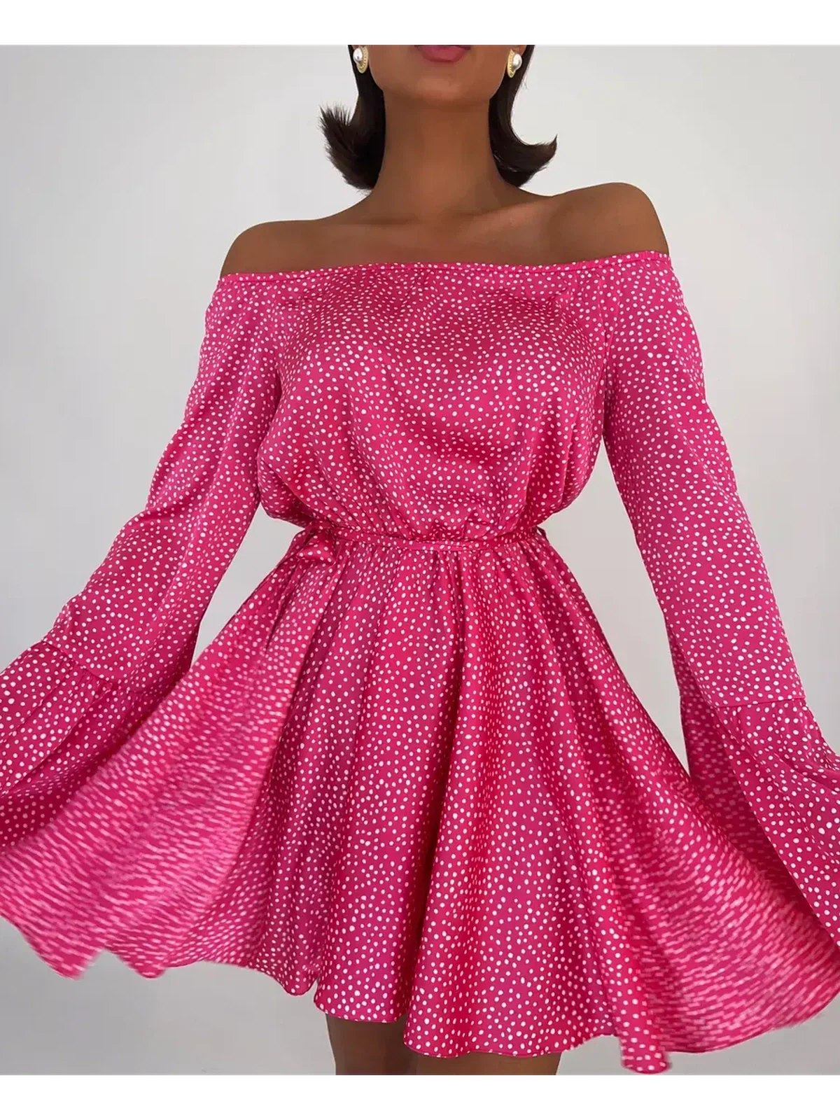 Flirt Pulse Mini Dress in vibrant pink with white polka dots, featuring off-the-shoulder style and flared skirt.