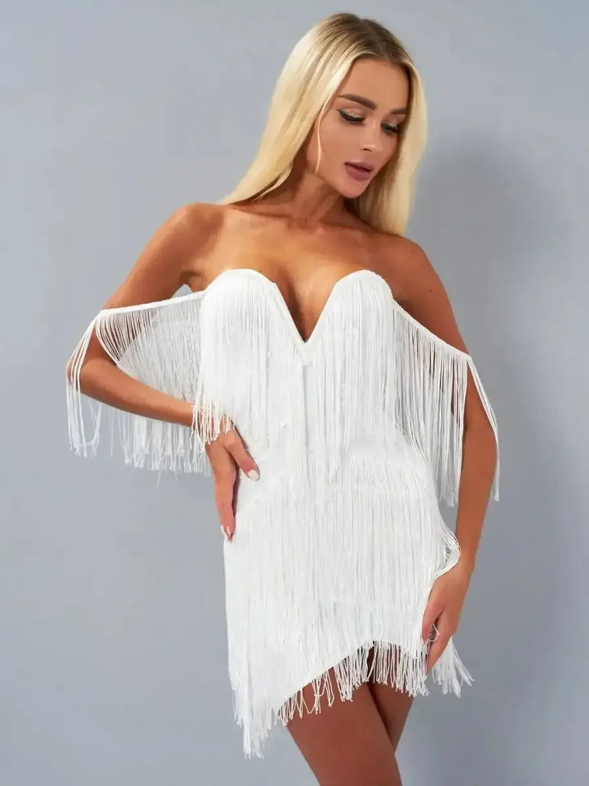 Fringe Fantasy white mini dress with cascading fringe detail, perfect for weddings, parties, and summer occasions.
