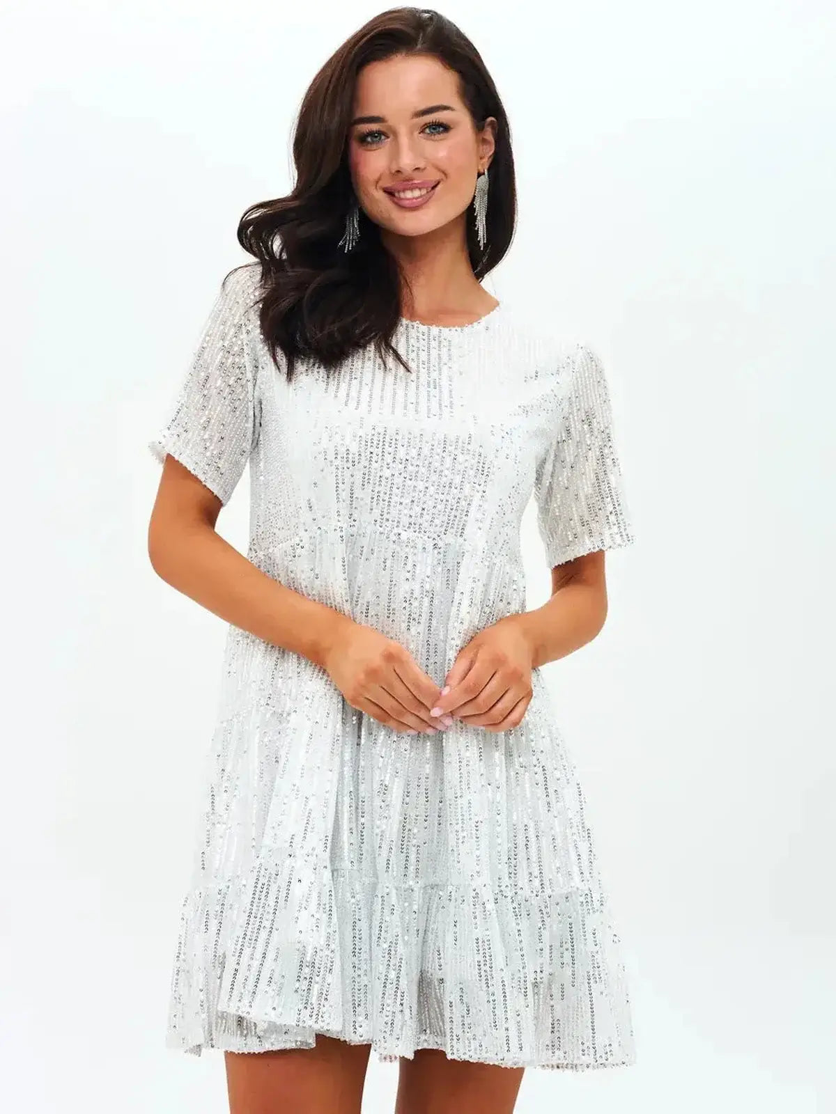 Model wearing the 'Frost Flicker' sequin mini dress, perfect for cocktail parties and summer occasions.