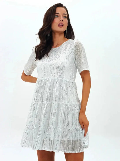 Frost Flicker white sequin mini dress with short sleeves and tiered ruffle hem, perfect for summer occasions.