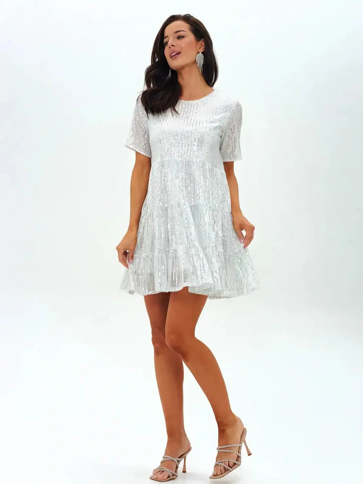 Sparkling white mini dress with short sleeves and tiered hem, perfect for summer parties and weddings.