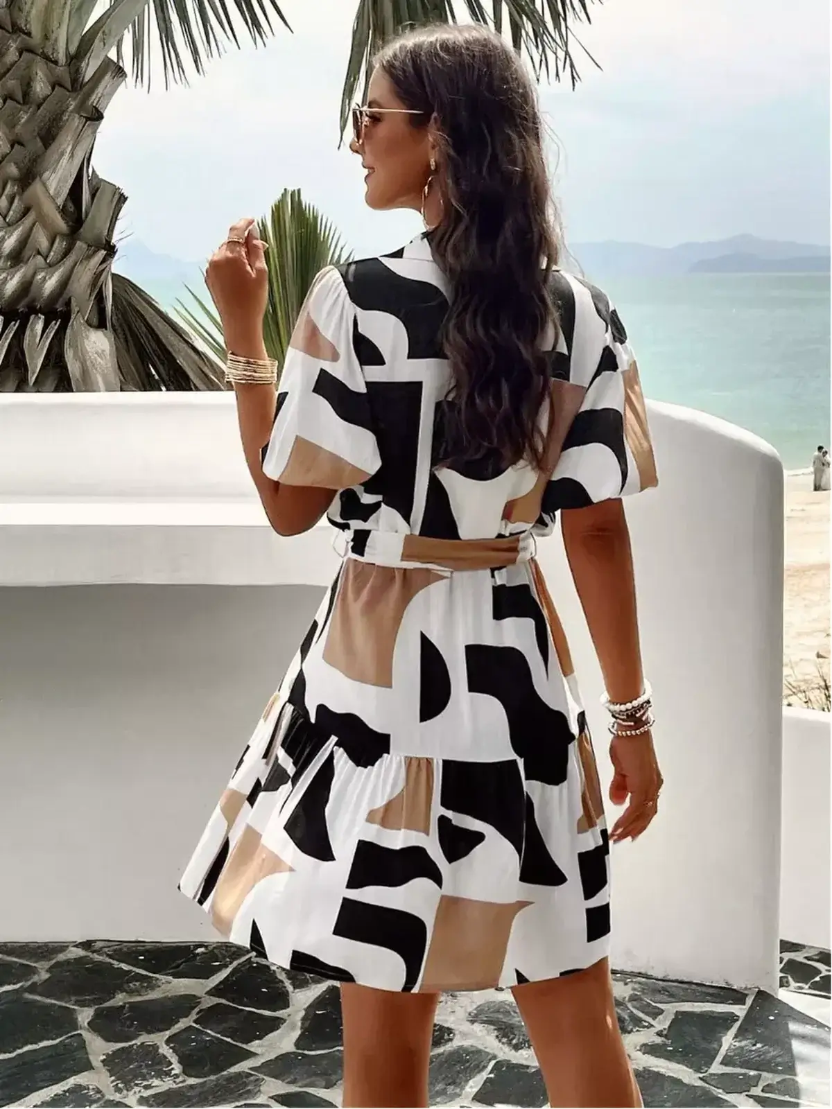 GeoChic Mini Dress featuring a bold abstract design, ideal for summer parties and casual outings.