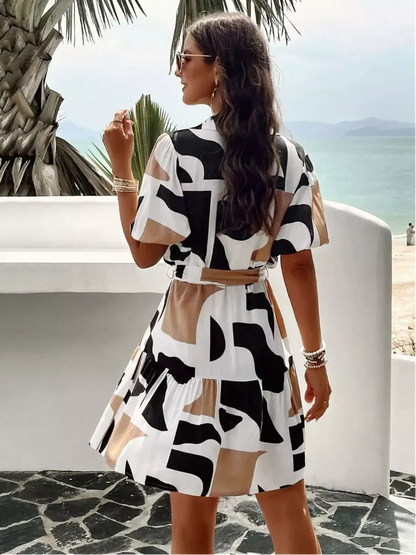 GeoChic Mini Dress featuring a bold abstract design, ideal for summer parties and casual outings.