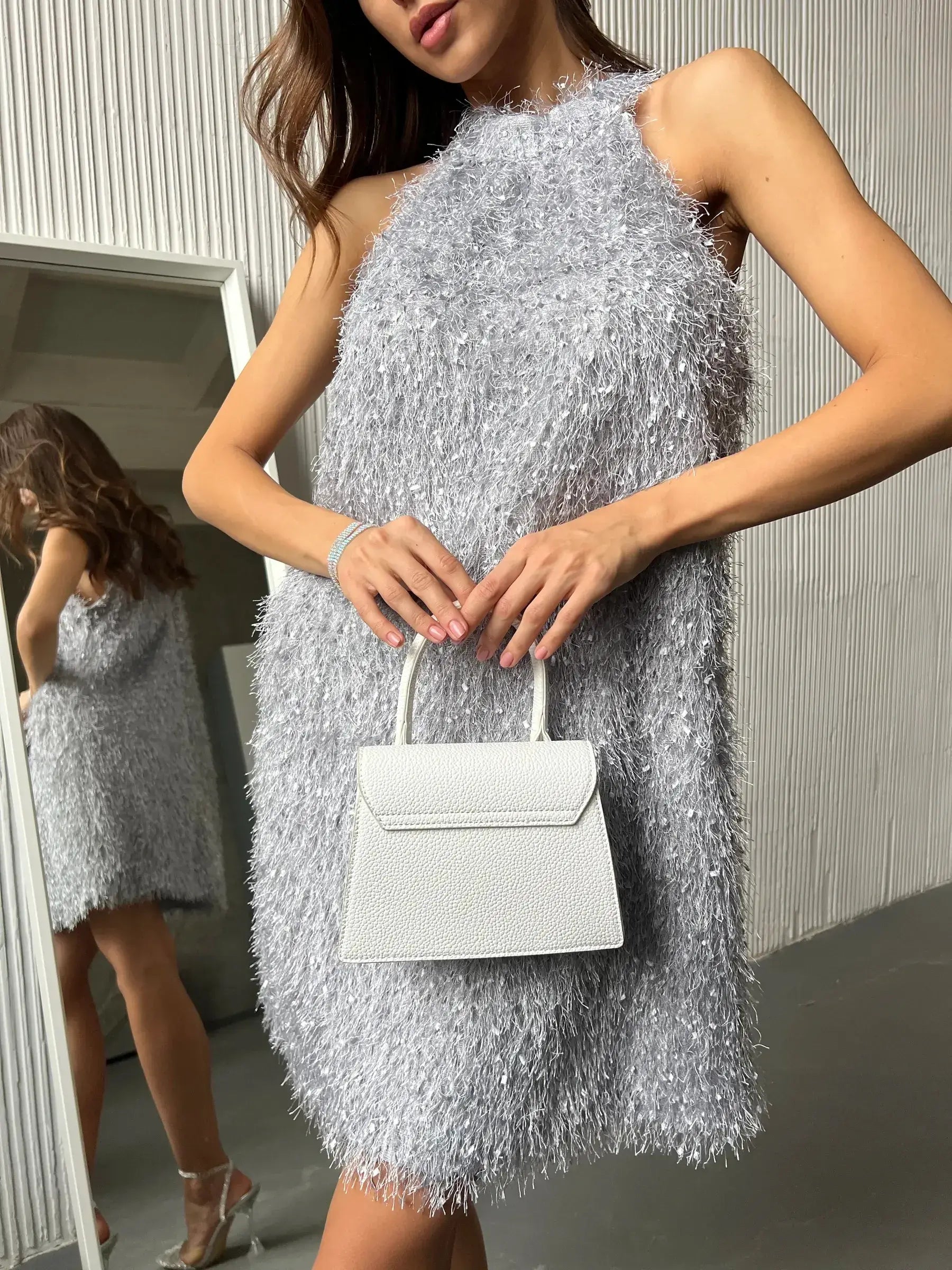 Glamorous silver halter mini dress with fringe, perfect for summer dresses and cocktail parties.