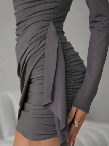 Close-up of the Gray Allure mini dress highlighting its luxe ruched texture and flattering silhouette, perfect for elegant occasions.