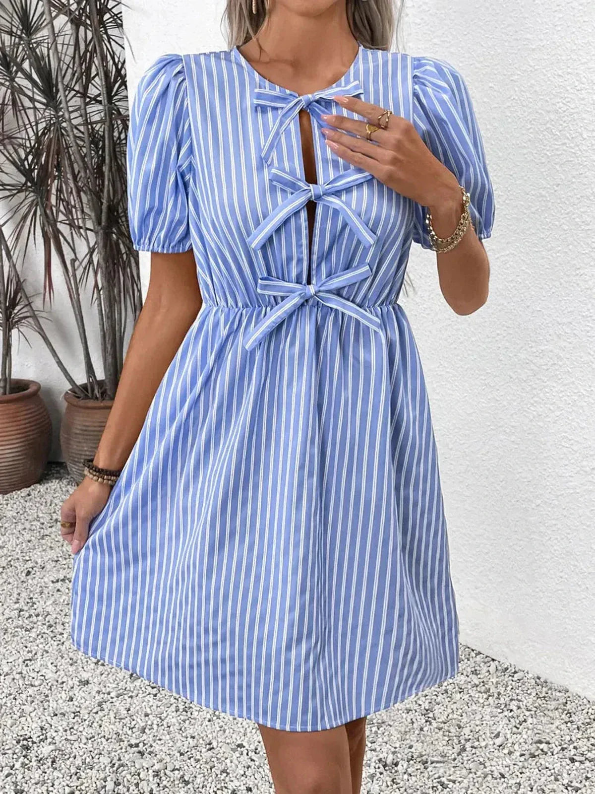 Harbor Stripe Mini Dress featuring puff sleeves and charming bows, perfect for summer events and weddings.