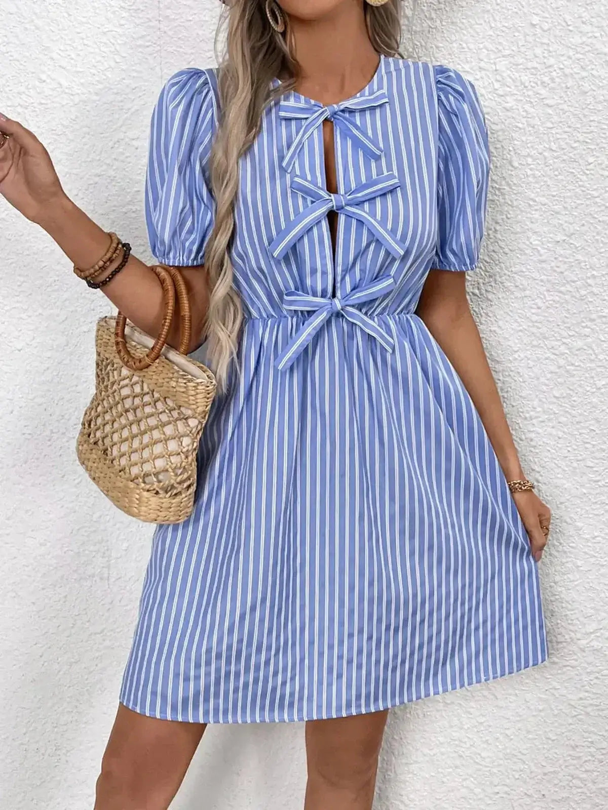 Harbor Stripe Mini Dress in blue and white stripes, featuring puff sleeves and bow details, perfect for summer outings.