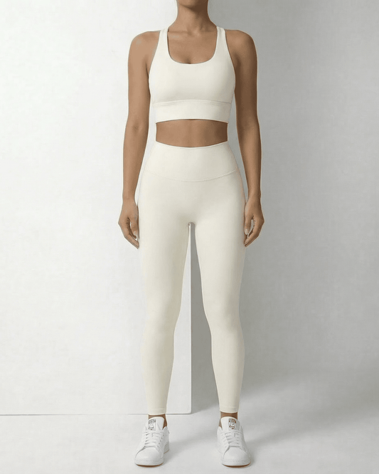 Iris Leggings Cream by Slimona featuring sleek ankle-length design with pockets and a comfortable fit.
