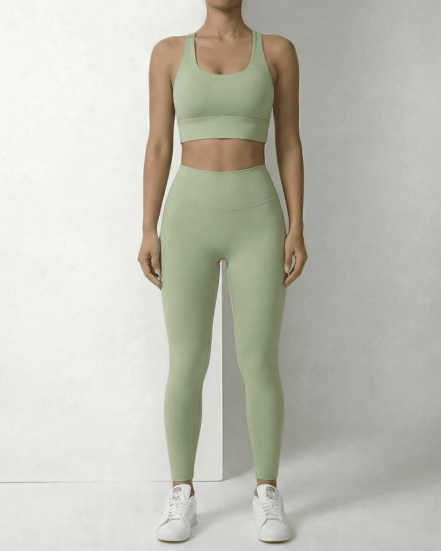 Iris Leggings Mint by Slimona in mint green on a model, showcasing a stylish ankle-length fit and supportive design.