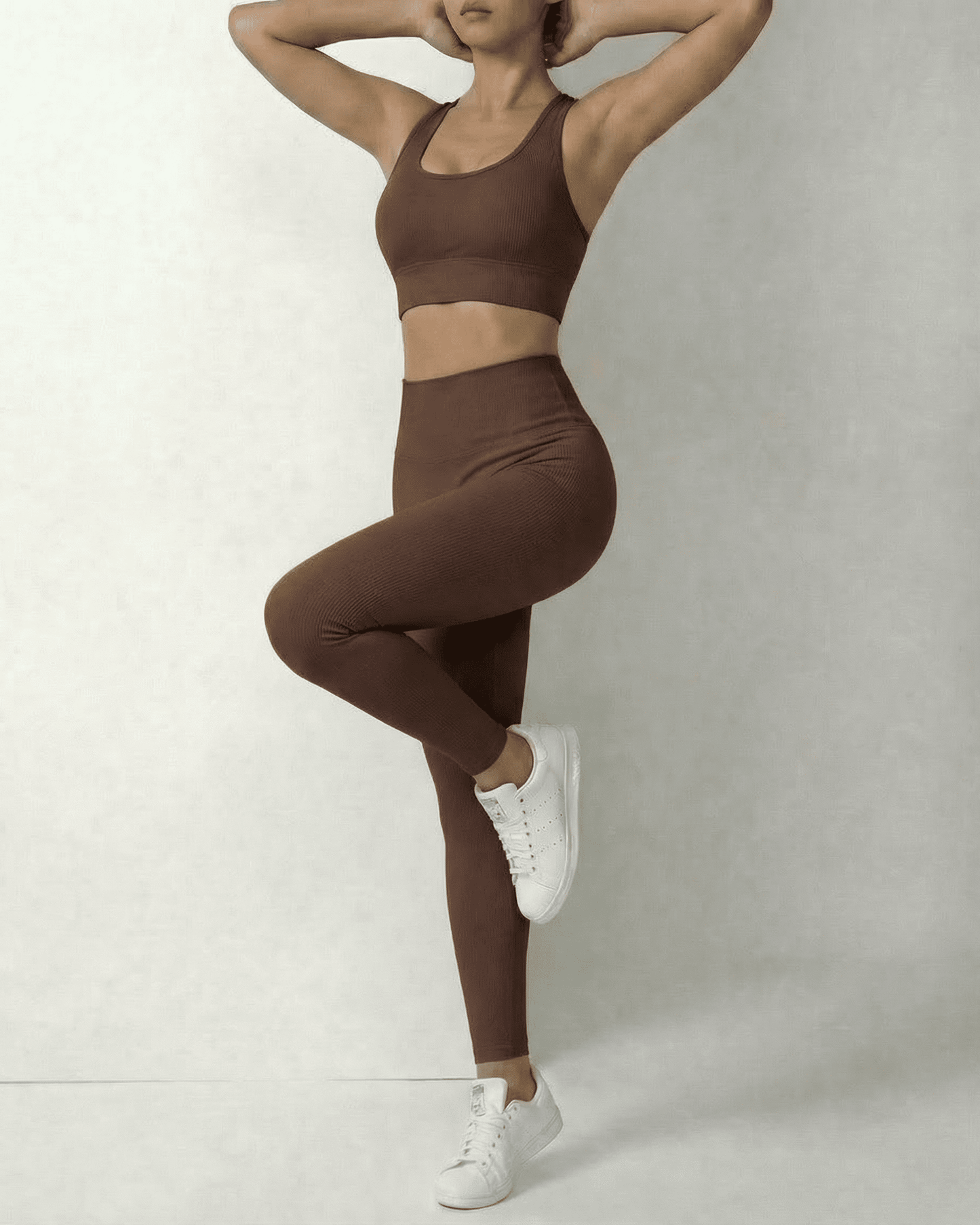 Model showcasing Hazel Leggings by Slimona in sleek brown high-waist design, perfect for comfort and style.