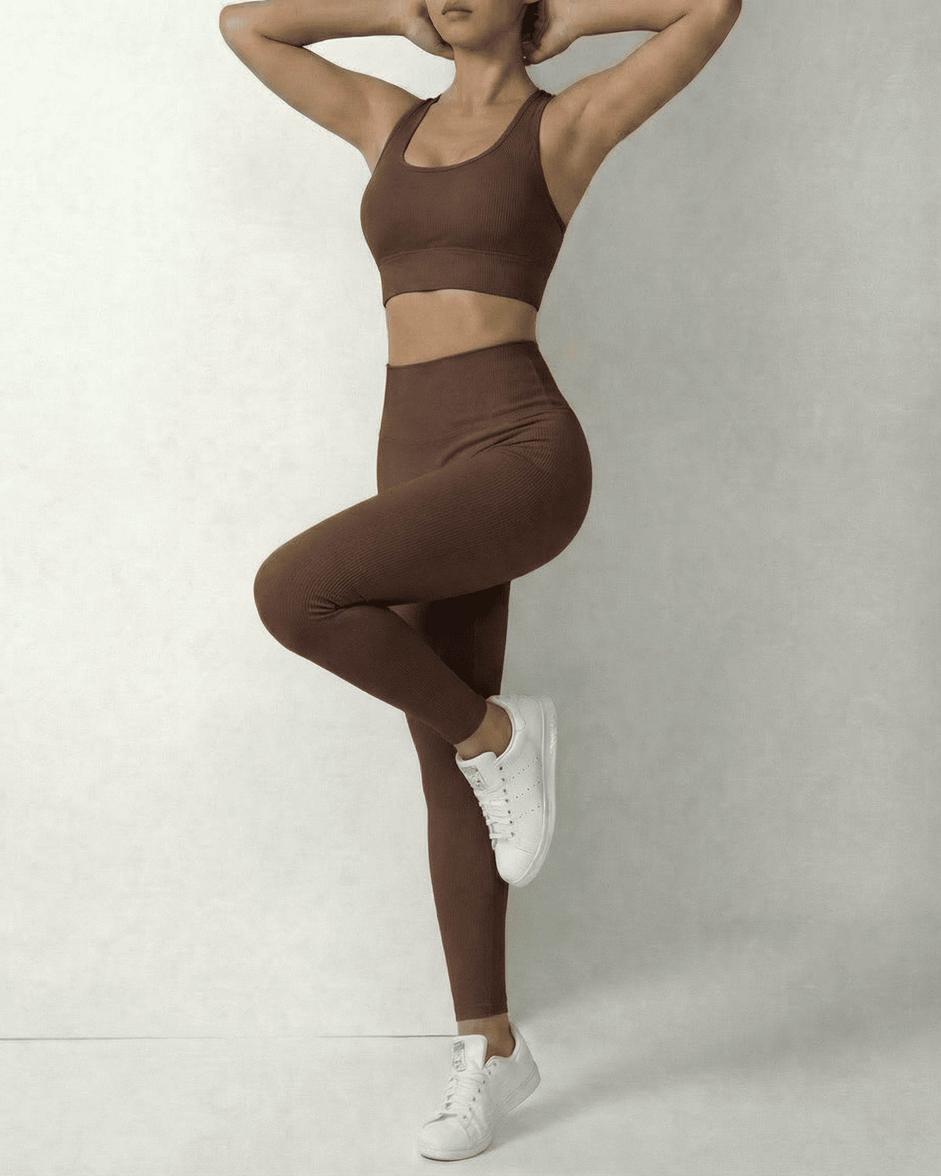 Model showcasing Hazel Leggings by Slimona in sleek brown high-waist design, perfect for comfort and style.