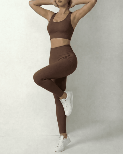 Model showcasing Hazel Leggings by Slimona in sleek brown high-waist design, perfect for comfort and style.