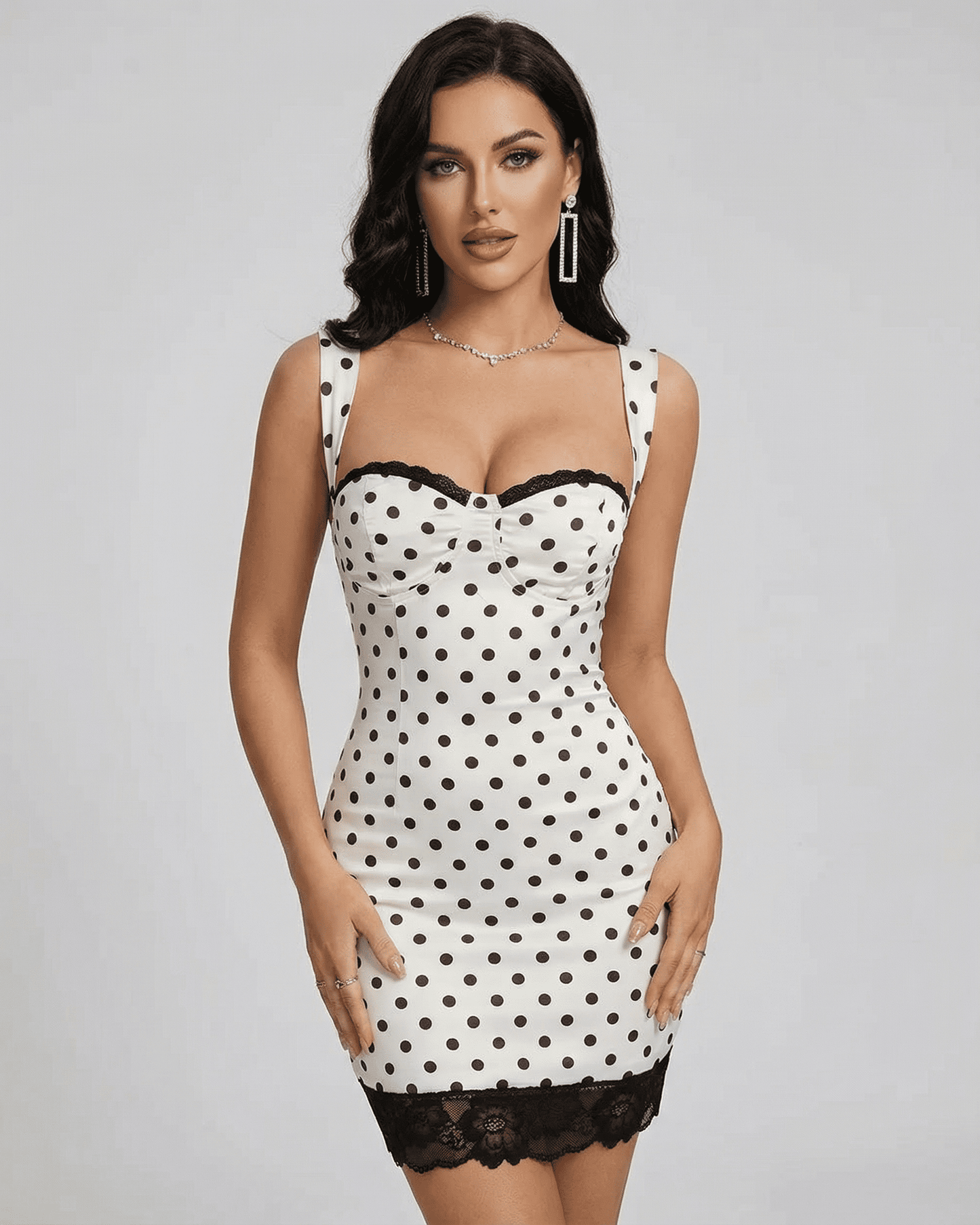 Celeste Mini Dress by Slimona featuring a polka dot design, lace trim, and a fitted silhouette.
