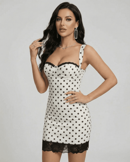 Celeste Mini Dress by Slimona, a stylish polka dot mini dress featuring lace trim and a modern off-the-shoulder neckline.
