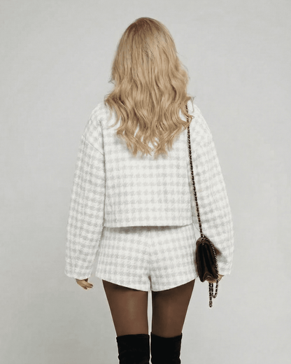 Back view of a model in the Slimona Luna Set, showcasing elegant tailored shorts and a chic long-sleeve top.