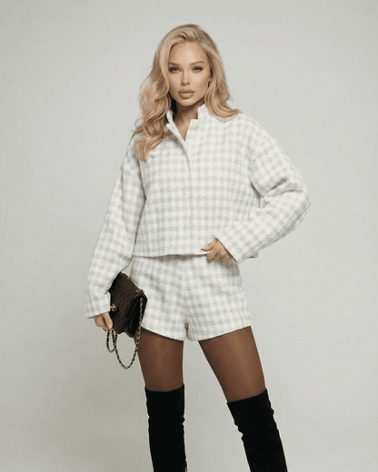 Elegant model wearing the Slimona Luna Set two-piece outfit with tailored shorts and textured long-sleeve top.